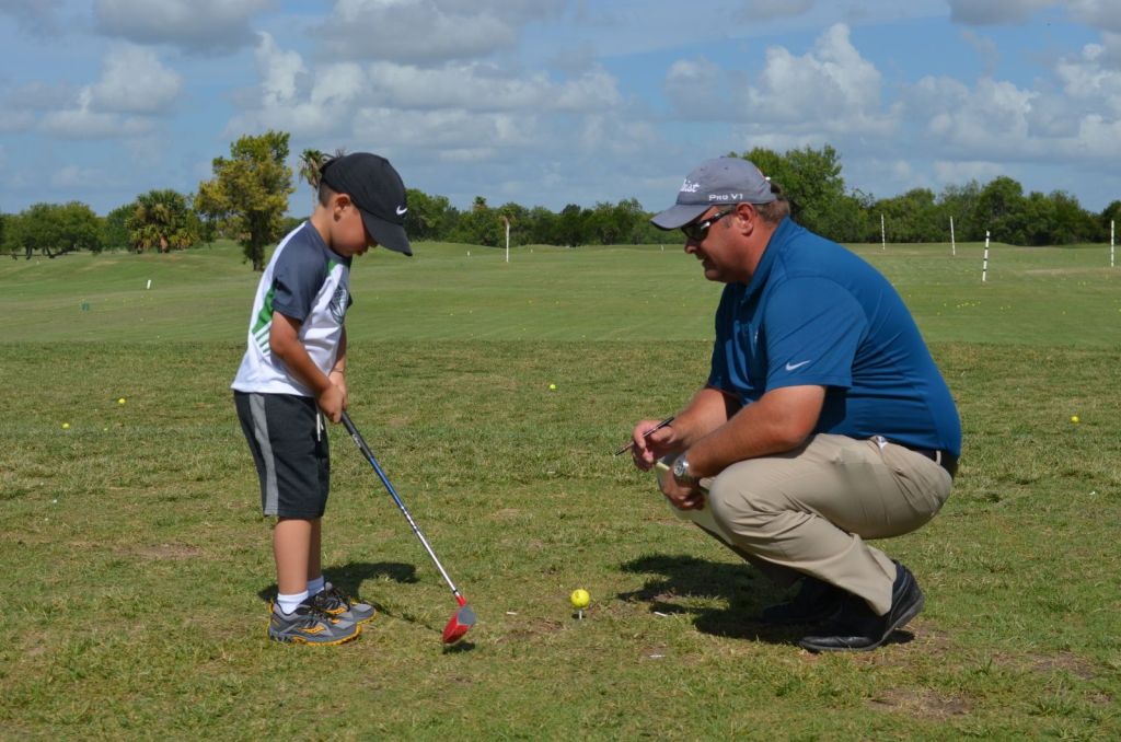 Instructor with student on golf course